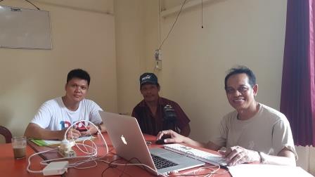 Dendi, Wayan, and Pak Melson working on an Enggano text